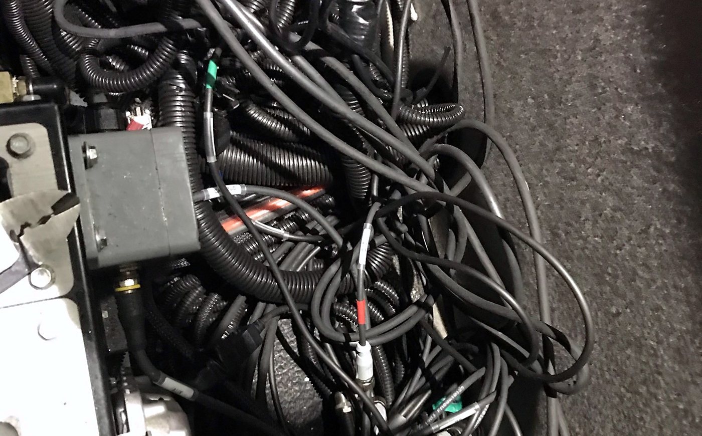 Unsecured harness pile found under a console