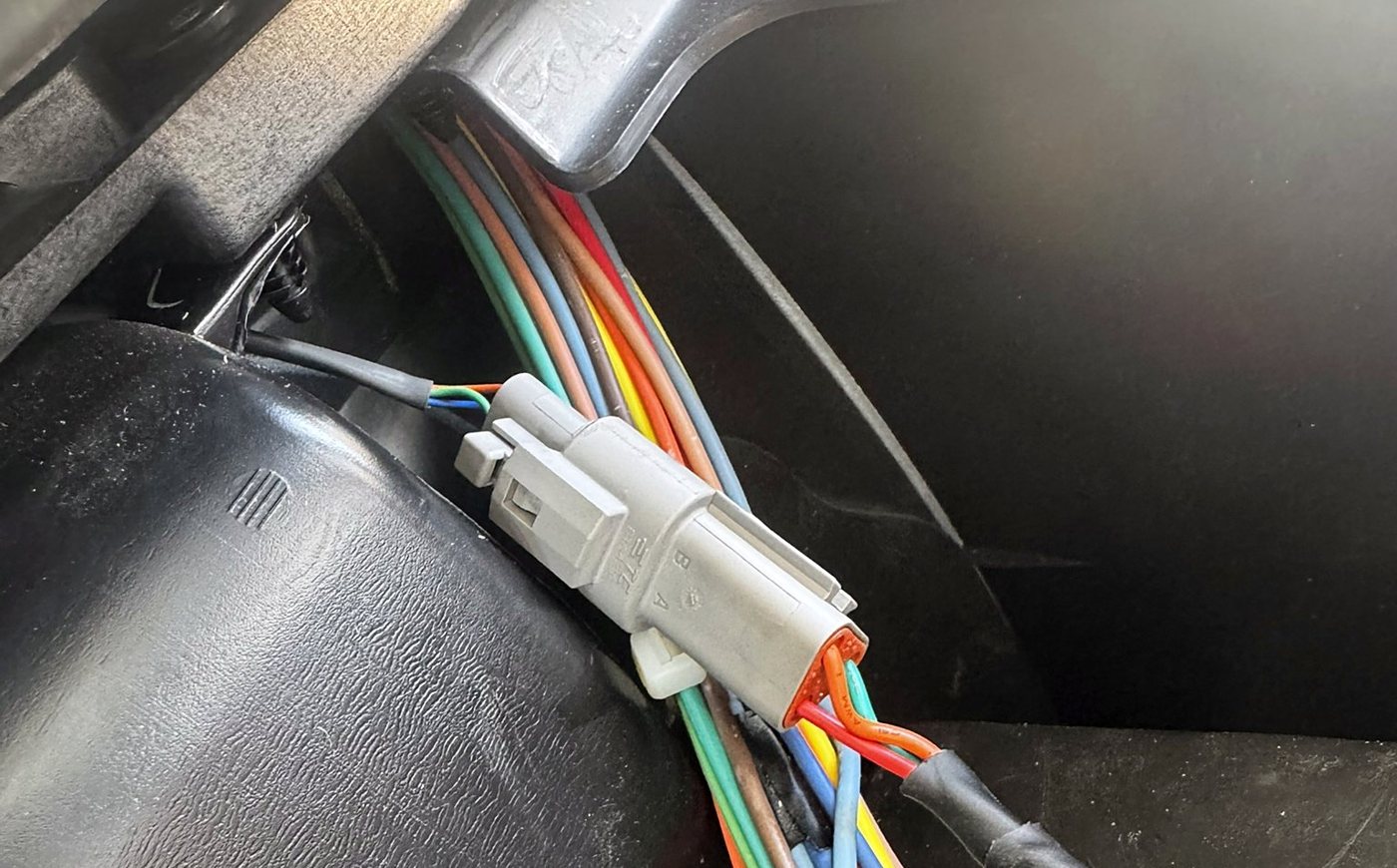 Sealed connector and braided harness