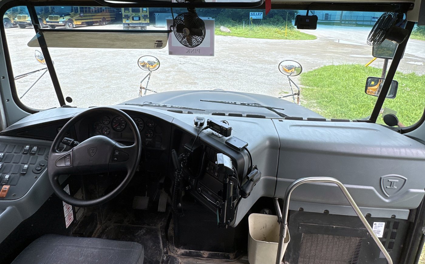 Finished school bus dash with tablet, radio and camera cleanly mounted