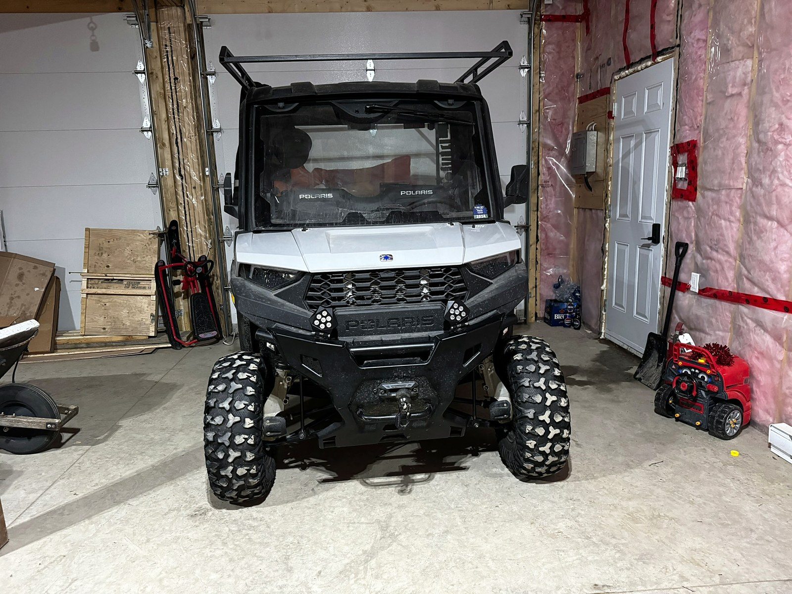 UTV with roof rack and auxiliary lighting