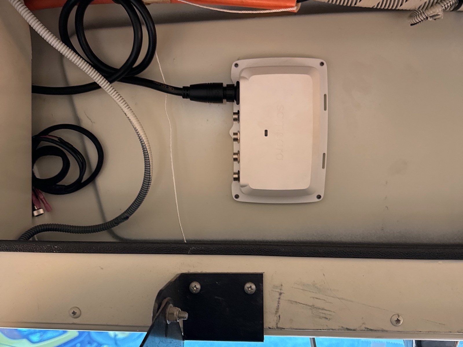 AI camera module mounted to the ceiling panel